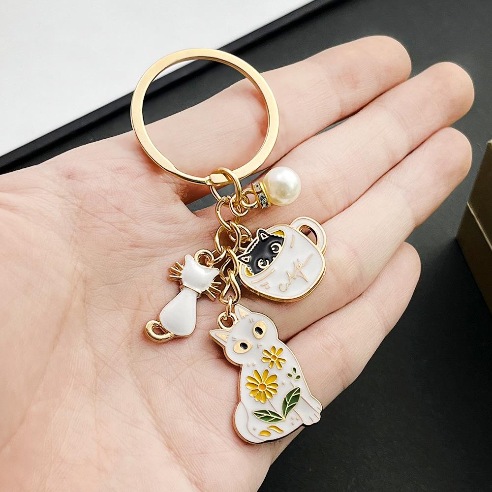 White Cat Pearl Teacup Keychain Ornament - Cartoon Drip Oil Finish