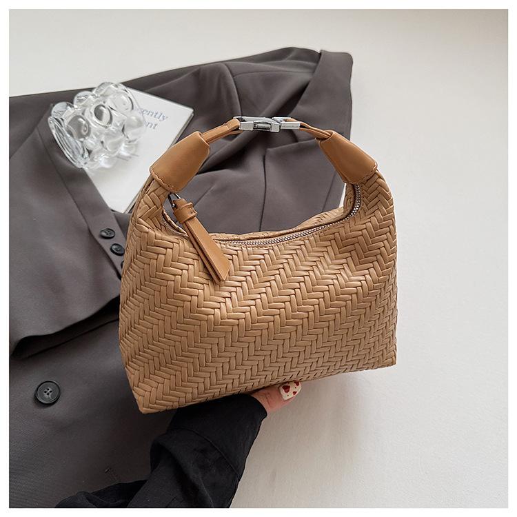 French Niche Woven Pattern Handbag Women's 2025 Spring and Summer Simple and Elegant Dumpling Bag Commuter Texture Messenger Bag