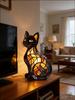 A cat-shaped table lamp made of resin with a warm diffusing light is a great gift for cat lovers.