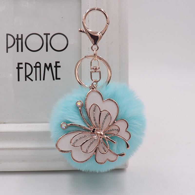 Exquisite Butterfly Plush Fur Ball Keychain for Bags, Cars, and Luggage.