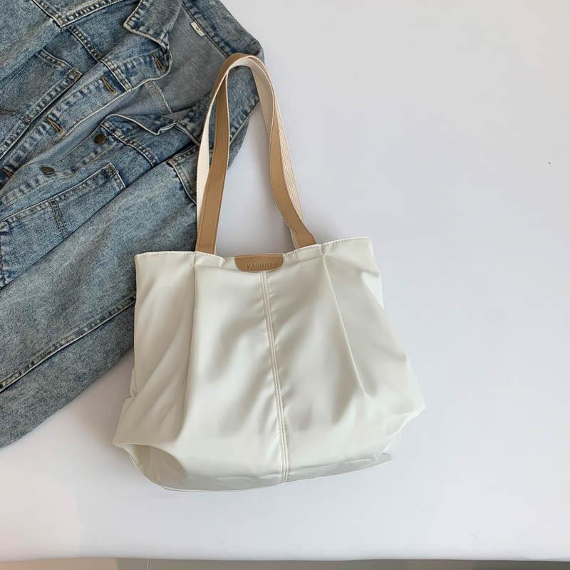 Large-capacity women's bags, new fashionable waterproof bags, portable shoulder large bags, casual and simple cloth bags.