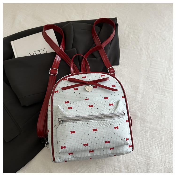 Schoolbag Korean version of college style women's shoulder bag 1011 new summer fashion bow small backpack shopping commuter bag