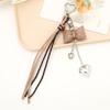 Trendy Korean Inspired Leather Tassels Bows Hanging Ornament Phone Charm Bag Accessories Key Holder for Stylish Women
