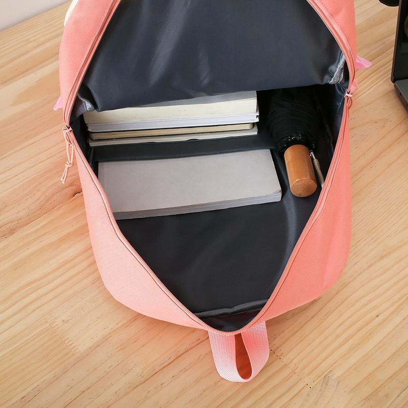 New student four-piece Korean version of cute campus sweet girl backpack large capacity rabbit print leisure bag