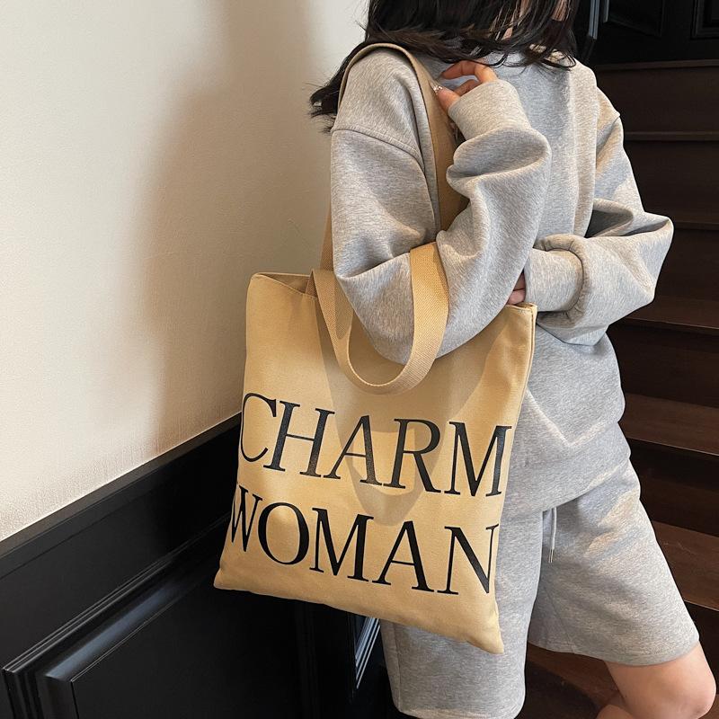 Large capacity alphabet canvas bag women's new fashion portable commuter bag versatile shoulder tote bag