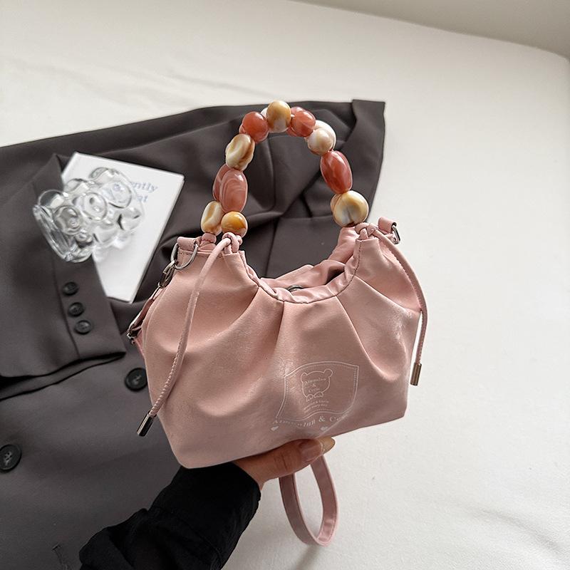 

Textured small bag women s 2025 summer new fashion foreign style beaded shoulder messenger bag niche design armpit bag розовый