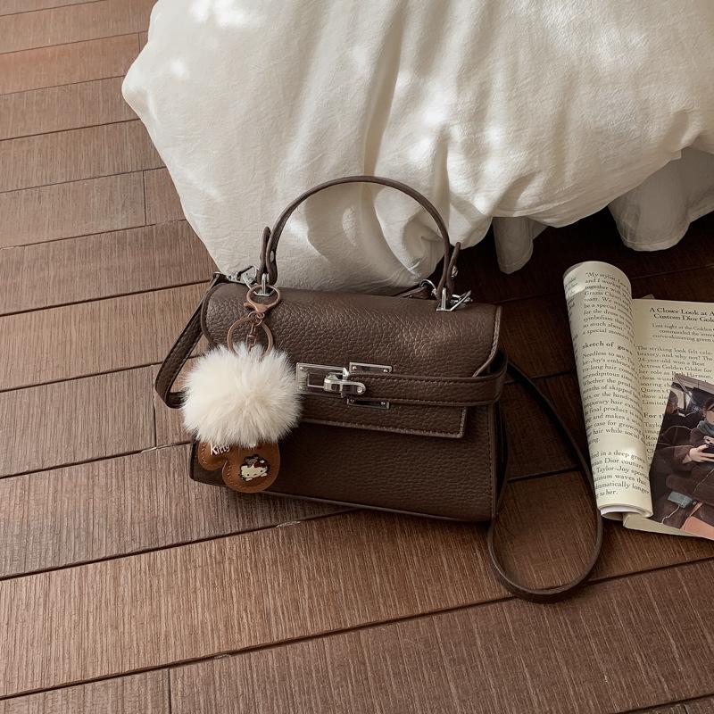 Elegant Commuting Bag for Work with A Chic Kelly Bag Style, Single-shoulder Cross-body Design.