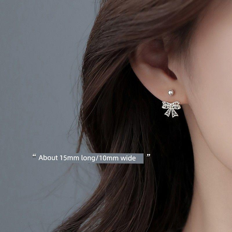 

Xiangnan Sterling Silver Stud Earrings 2024 New Niche Style Female Bows 999 silver Cut Out Bows stud earrings (two price)