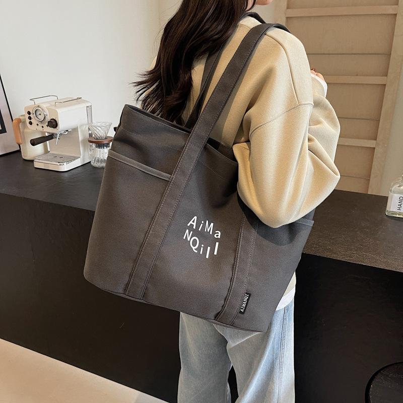 Lässige Canvas-Tragetasche Damen Herbst und Winter Schlichte Große Kapazität Ausgehen Leichte Tragetasche Pendlertasche