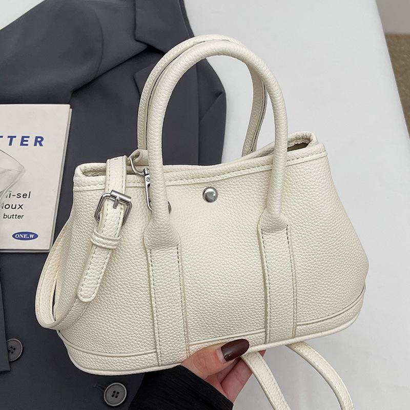New Niche Simple Leisure Commuter Portable Bucket Bag Versatile Design Sense Solid Color Messenger Bag Women
