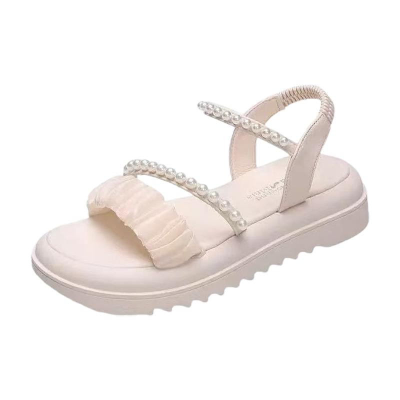 Stepping on shit sandals women's summer 2025 new beach shoes ins trendy fairy wind flat bottom wear non-slip Roman sandals