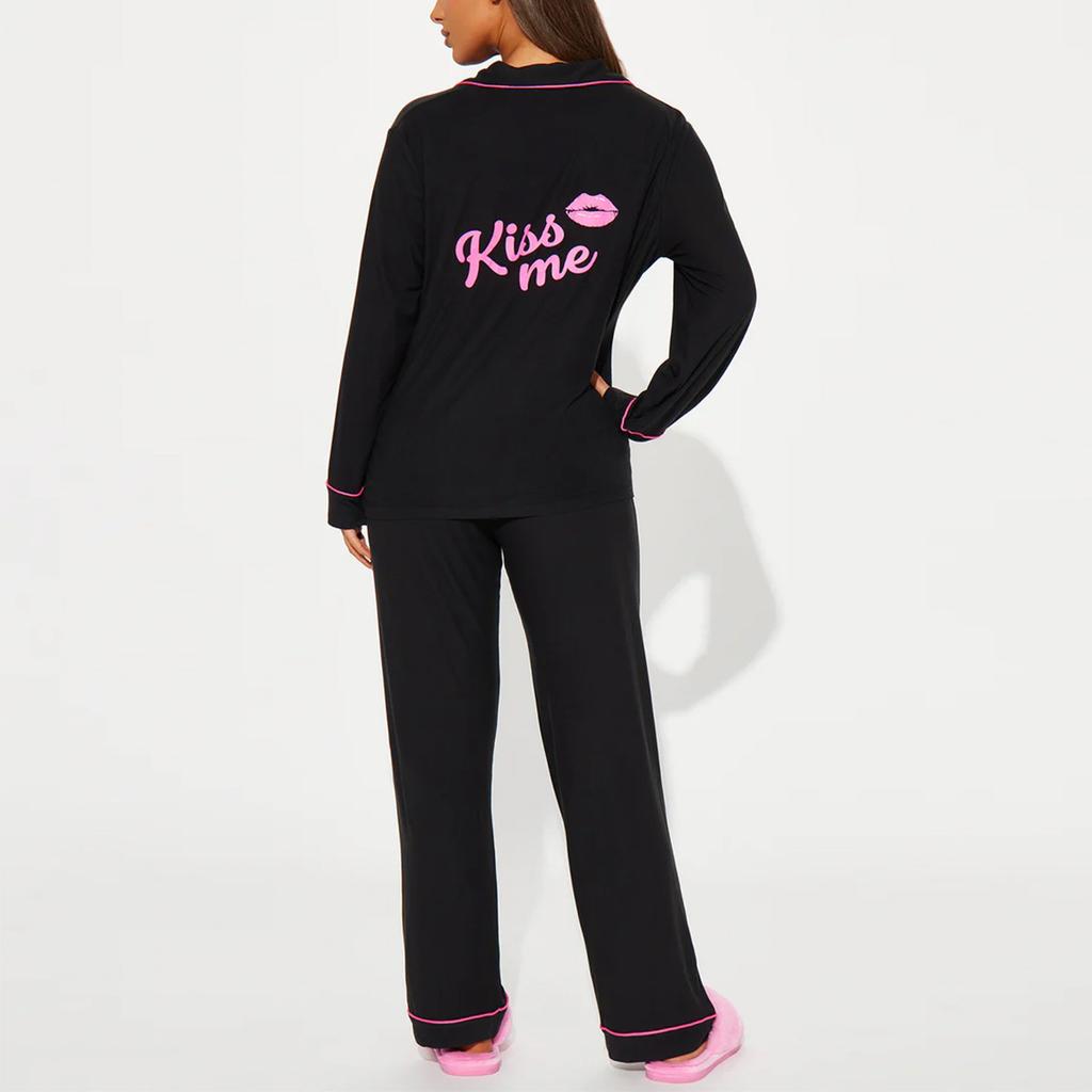 A Woman Wears A Two-piece Pajamas with A Cardigan, Printed Long Sleeves and Long Pants Over Her Home Dress