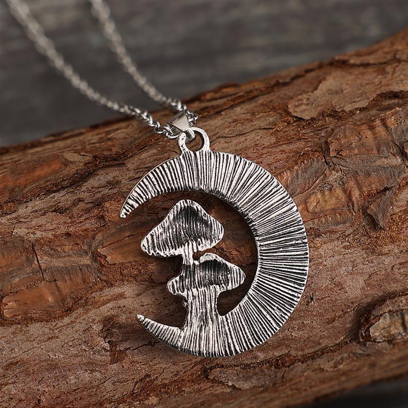 A stylish and cute red mushroom pendant necklace with a moon and a little girl design, suitable for women's everyday wear.