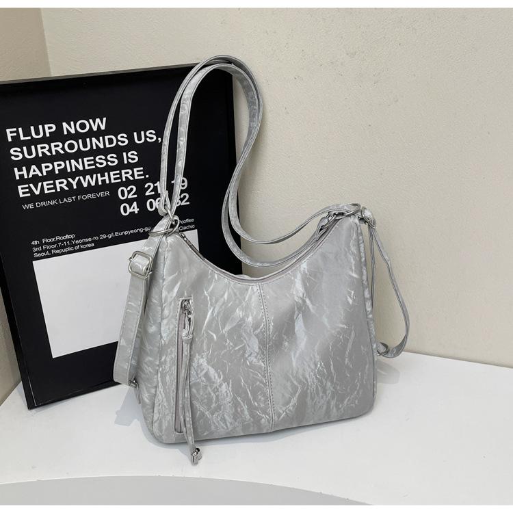 

2025 spring new solid color niche armpit new large-capacity versatile shoulder backpack can cross the shoulder серебряный