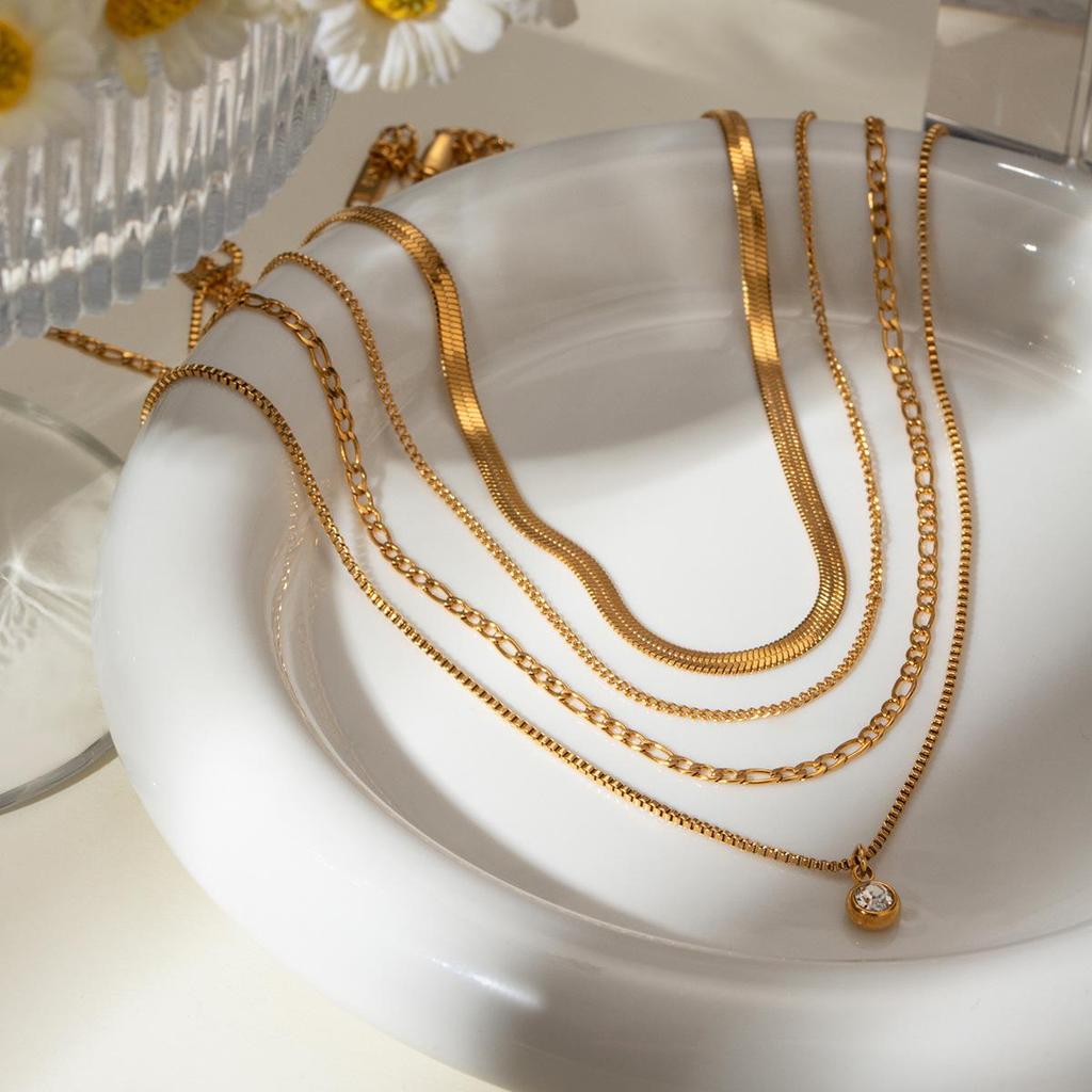 European & American Influencer Fashion Necklace: 18K Gold Stainless Steel Four-Layer Chain with Diamond Pendant.