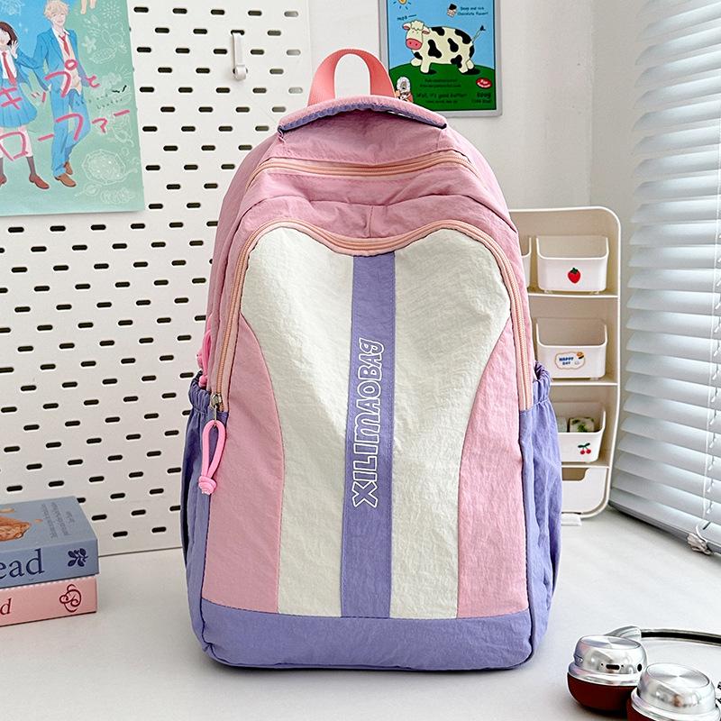 New college students large-capacity junior high school students backpack men s fashion versatile lightweight trendy cool schoolbag women розовый
