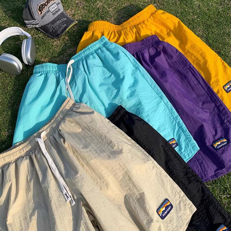 American Style Quick Drying Shorts for Men In Summer Thin Ice Silk Sports and Casual Mid Length Pants Versatile and Loose Beach Five Quarter Pants