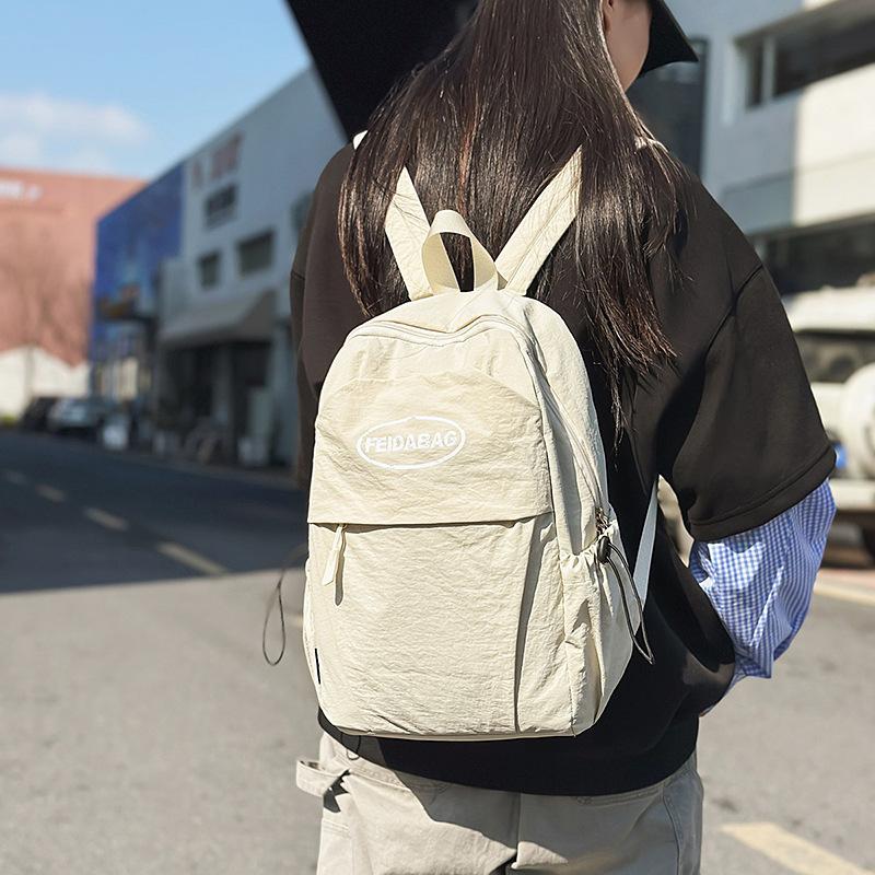 Casual style lightweight nylon letter student schoolbag Korean version men s and women s daily commuting backpack белый
