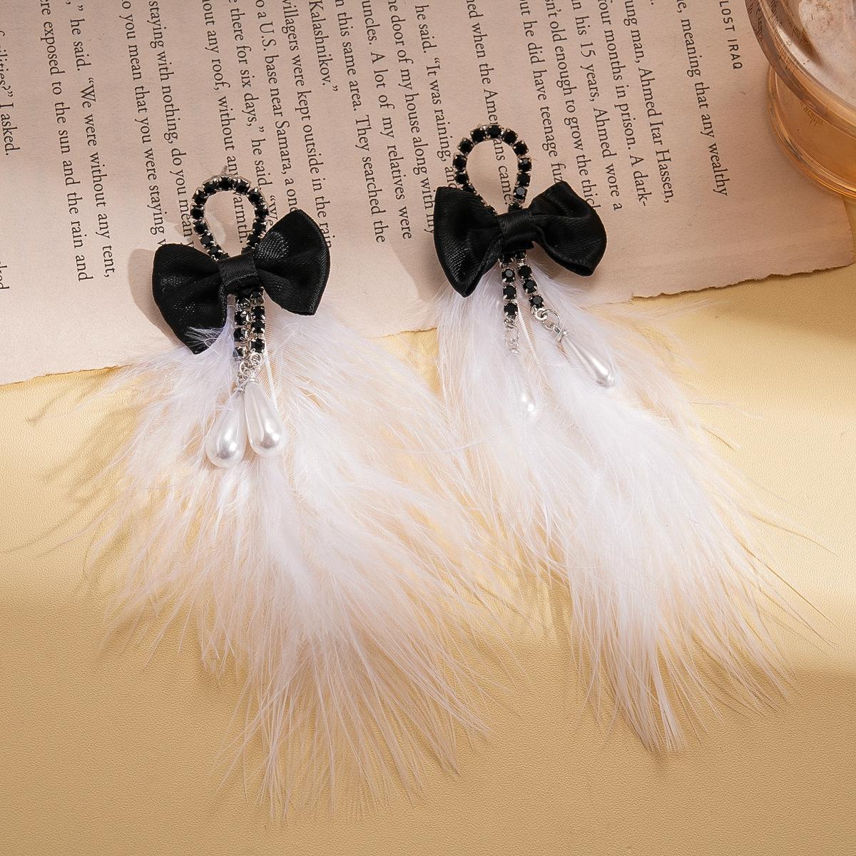 

Diamond imitation pearl ribbon feather bow silver needle earrings autumn and winter exaggerated earrings