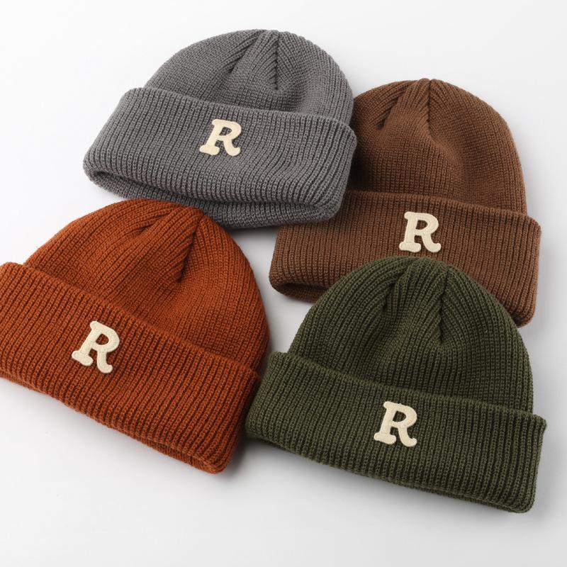 Women's Solid Color Letter Print R Rolled brim knitted hat for outdoor cycling, providing warmth, cold protection, and ear coverage
