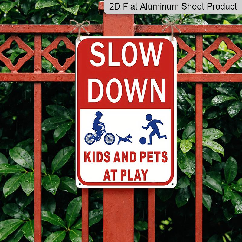 2D Flat Slow Down At Play Metal Sign - Durable Metal Safety Signage, 12*8 Inches, Easy To Install, Red and White with Blue Graphics, Perfect for