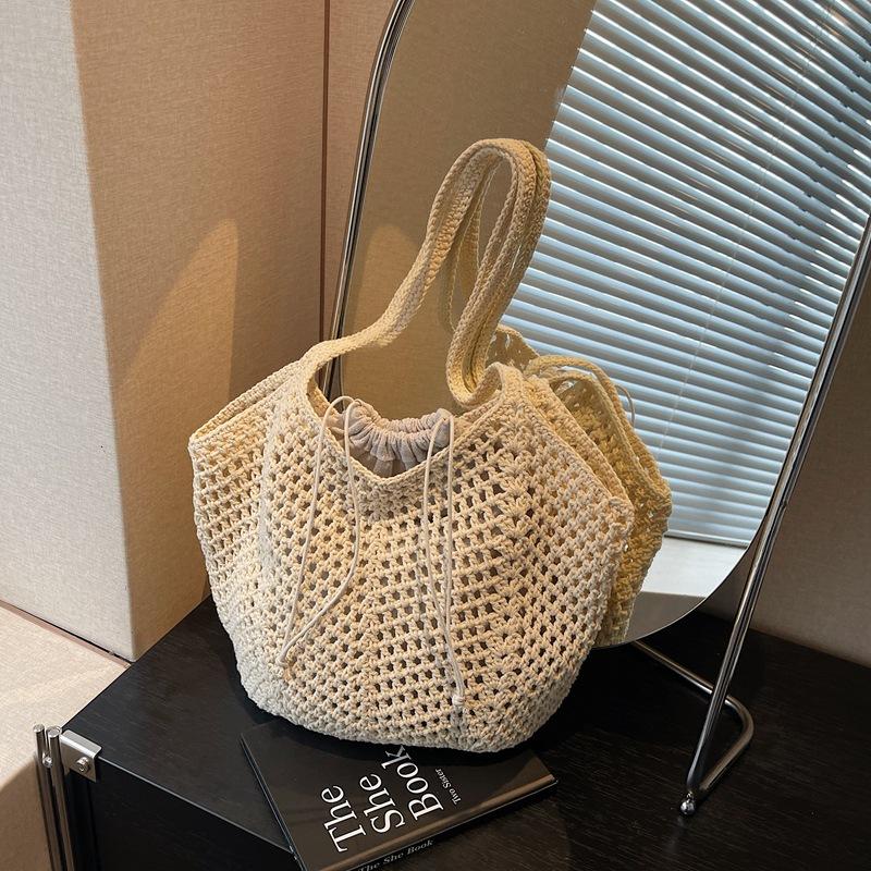 2025 spring and summer new hollow bucket bag shoulder woven bag large capacity tote bag fashionable beach women's bag