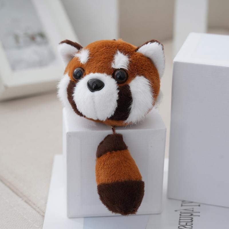 

Милая мягкая коричневая плюшевая панда, идеально подходящая для брелоков и коллекционных фигурок