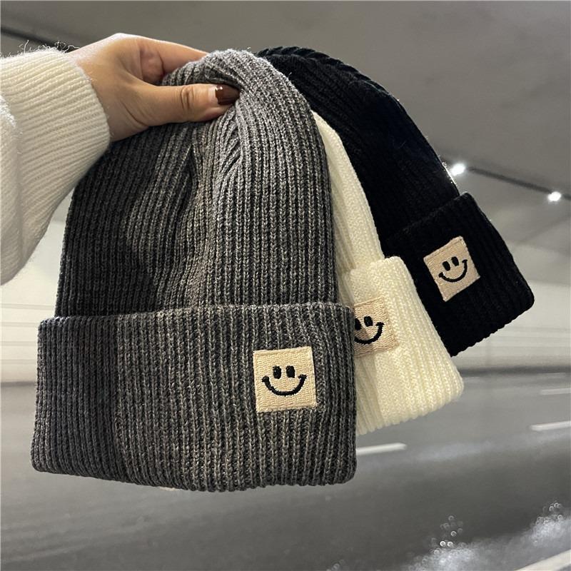 Cute smiley face label wool hat women's autumn and winter warm trend versatile ear protector black knitted hat men