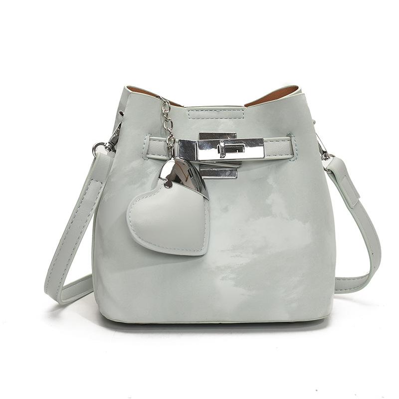 Spring and summer new Korean fashion high-end texture bucket bag niche design fashionable commuter versatile messenger women's bag