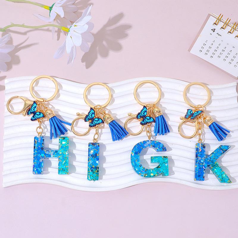 1 Stück Schriftzug Schlüsselanhänger für Rucksackanhänger Schlüsselanhänger Schlüsselring mit Quaste Schmetterling Niedlich Farbverlauf Harz Blau Pailletten