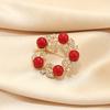 Red round brooch female high-end female corsage pin pearl suit light luxury niche light luxury simple accessories suit
