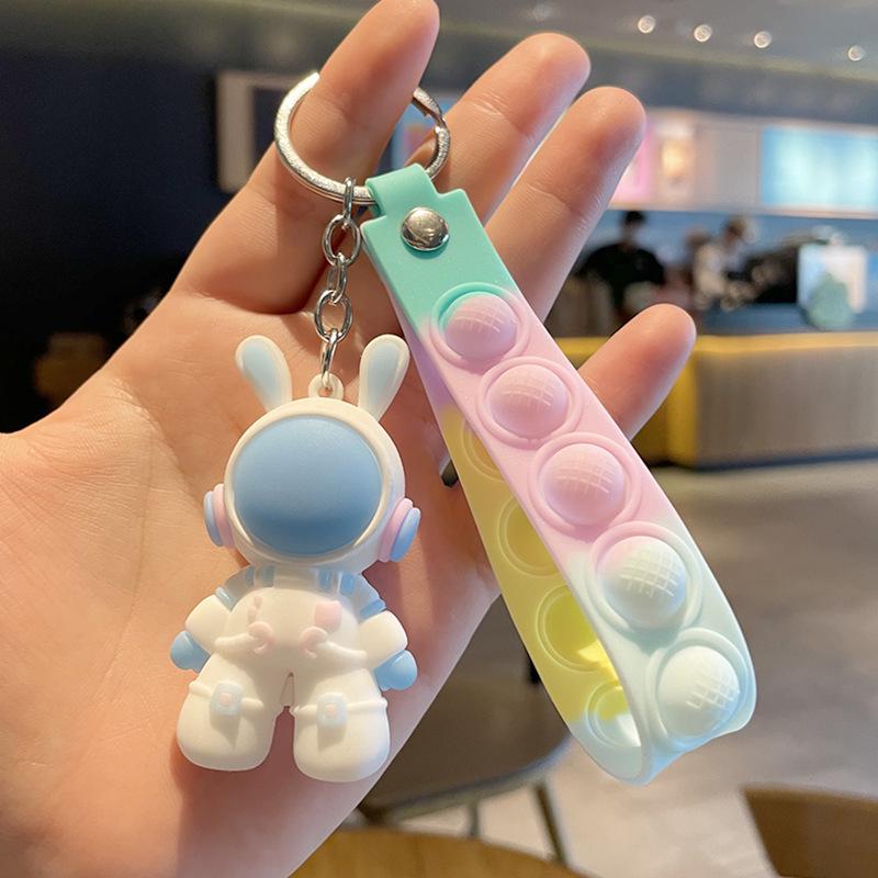 

Cute Spaceman Couple Keychain: Cartoon Astronaut Soft Rubber Pendant Charm