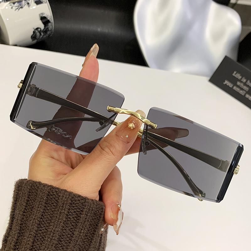 New Curved Lens Leopard Head Metal Frameless Edge Cutting High-Quality Sunglasses 90300