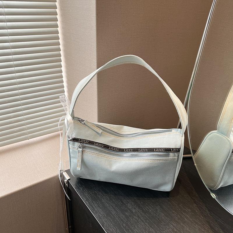 

Popular Korean niche trend denim hand carrying baguette bag women 2025 new versatile commuter shoulder armpit bag джинсовый синий