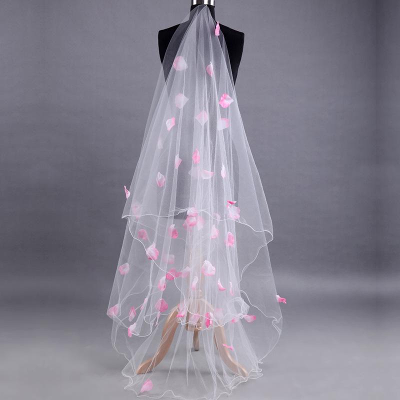 Romantisches Hochzeitskleid mit Schleier Rosa Blüten Verzierungen Schleierlagen Tüll Bandkante Brautschleier