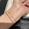 Handgewebtes rotes Schnurarmband mit vergoldetem vierblättrigem Klee-Anhänger für Damen, Paare, Luxuriöser minimalistischer Stil