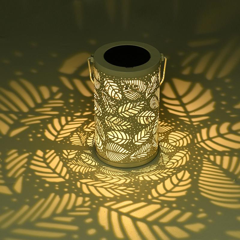 2026 New Solar Waterproof Iron Hollow Lantern Outdoor Hanging Ambient Light for Lawn Garden Villa Patio Yard Decoration