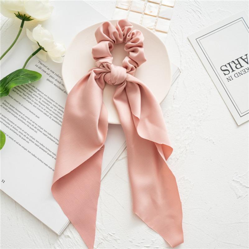 Long flowing ribbon large braided hair accessory for women - ponytail bun hair band with floral design, simple and elegant.
