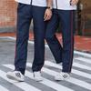Unisex Dark Blue School Pants with Red Stripe - Loose, Straight-Leg Design for Primary To High School Students.