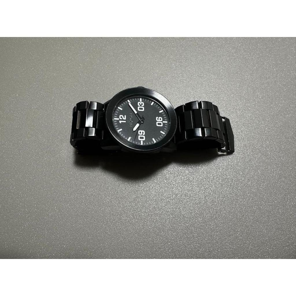 Used Nixon wristwatch, dead battery, black, no parts removed after belt adjustment