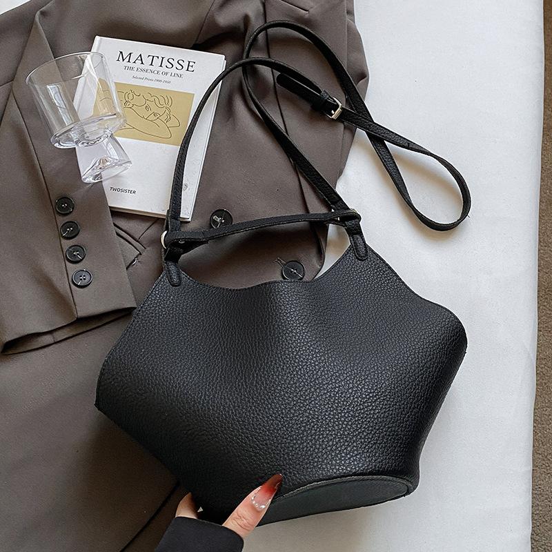This year, the Korean version of the simple lychee pattern portable mother and child bag is popular, high-end, lightweight and versatile fashion mess