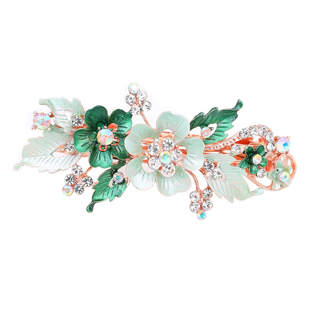 

Изящная женская заколка из ювелирного сплава, с цветами и кристаллами горного хрусталя зелёный