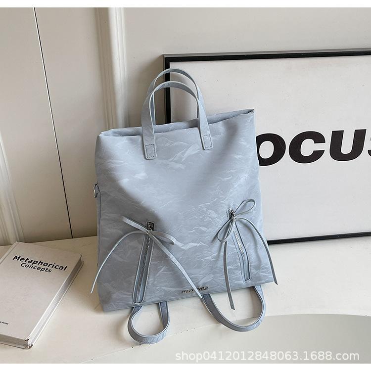 

Рюкзак с бантом для балета Женский 2025 Новый Модный Большой вместимости Дорожный Мессенджер Рюкзак для коротких поездок синий