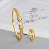 2026 Trendy Gold-Plated Copper Snake Bracelet & Ring Set with Green Eye and Full Diamond Micro-Pave