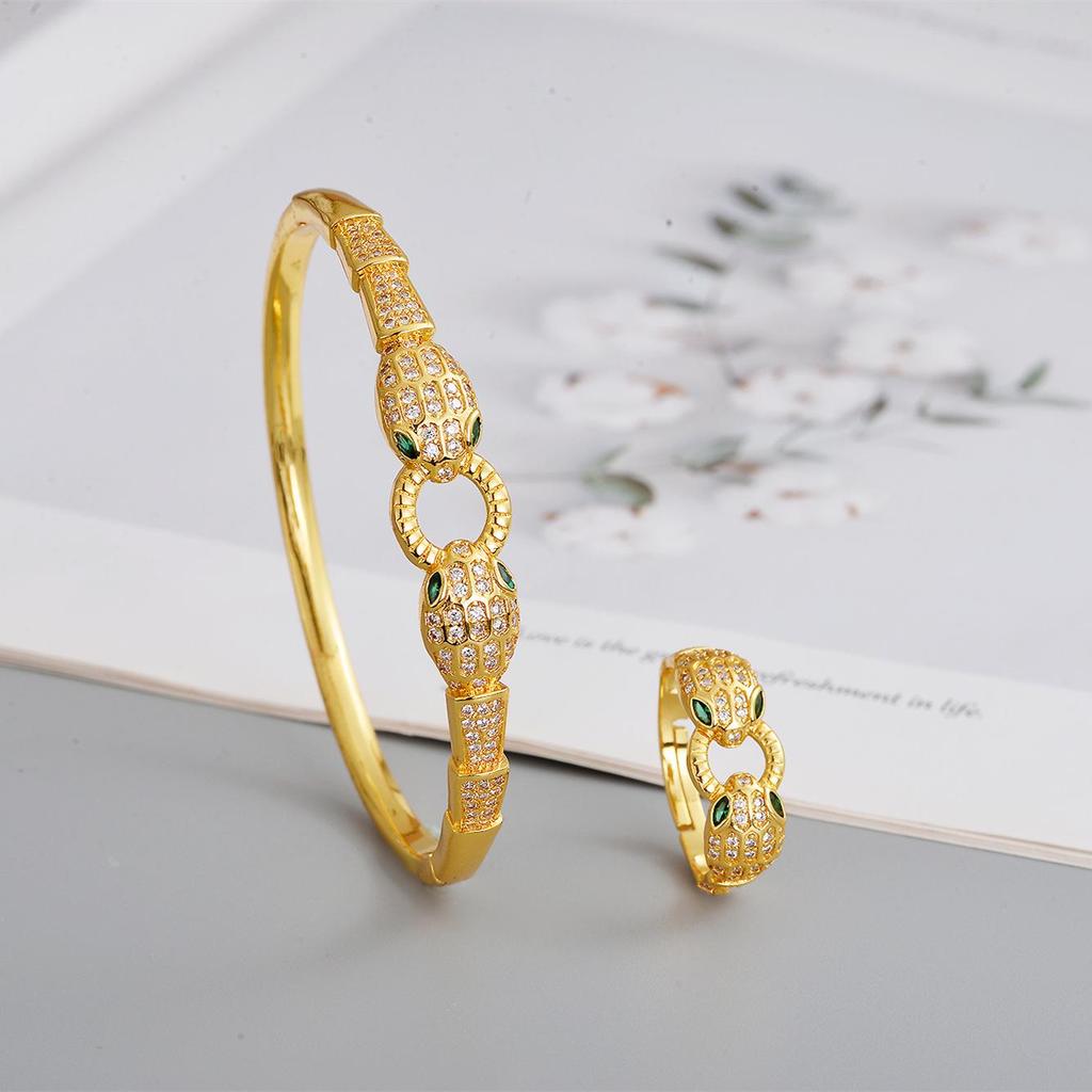 2026 Trendy Gold-Plated Copper Snake Bracelet & Ring Set with Green Eye and Full Diamond Micro-Pave
