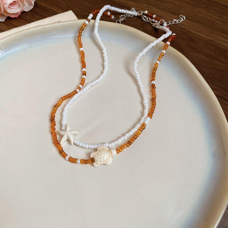 

Elegant Double-Layer Starfish Turtle Necklace with Rice Beads for Women - Perfect Beach Vacation Accessory