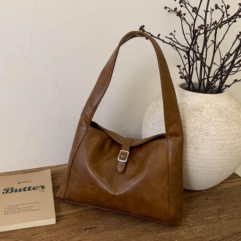 

Light luxury niche hand carry armpit bag 2025 autumn new large-capacity simple daily commuter tote shoulder bag темно-коричневого