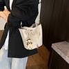 Beliebte tragbare Eimertasche Damen Frühling und Sommer 2025 Neue einfache und lässige Umhängetasche Modische Umhängetasche