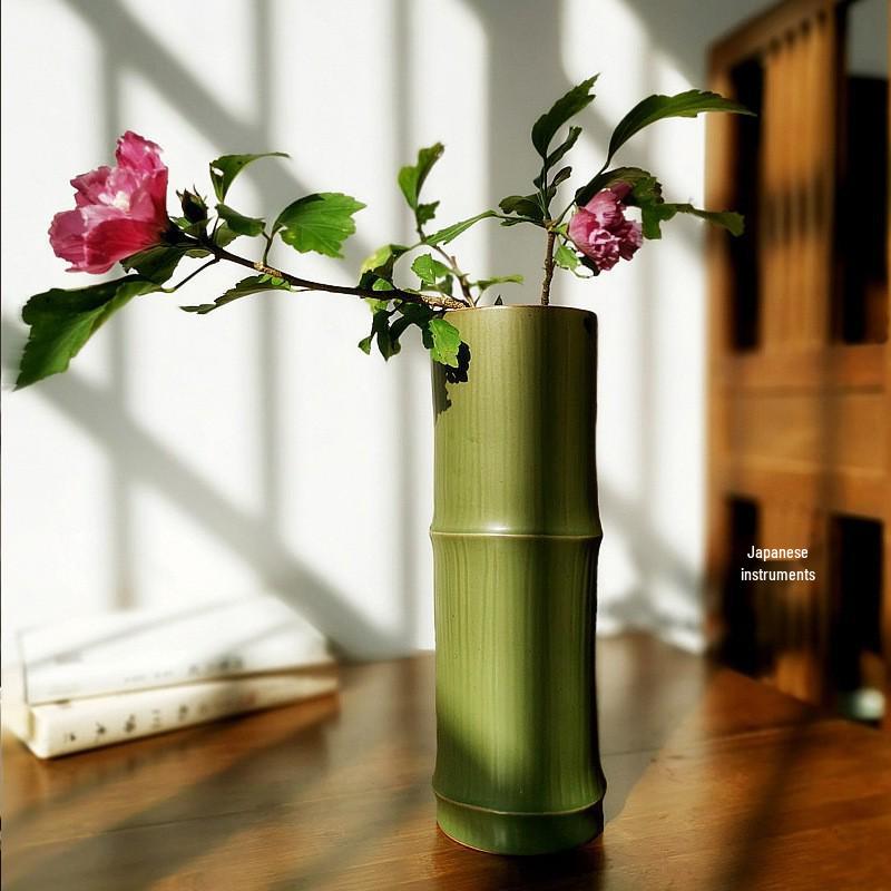 

Zen Bamboo Joint Wall Hanging Vase: Ceramic Flower Holder for a Simple, Creative Arrangement. Bamboo Leaf Green
