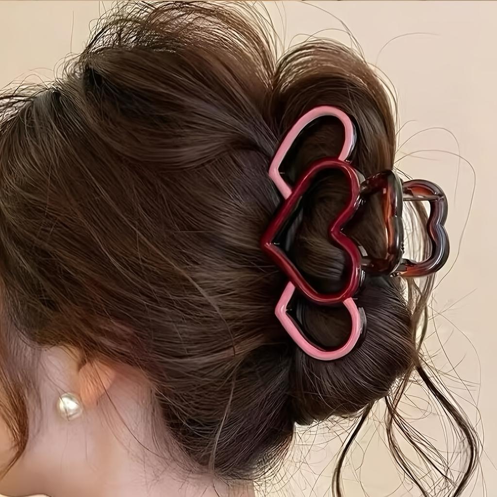 One elegant heart-shaped hairpin, a half-tied hairpin, a stylish hairpin, and a shark clip at the back of the head